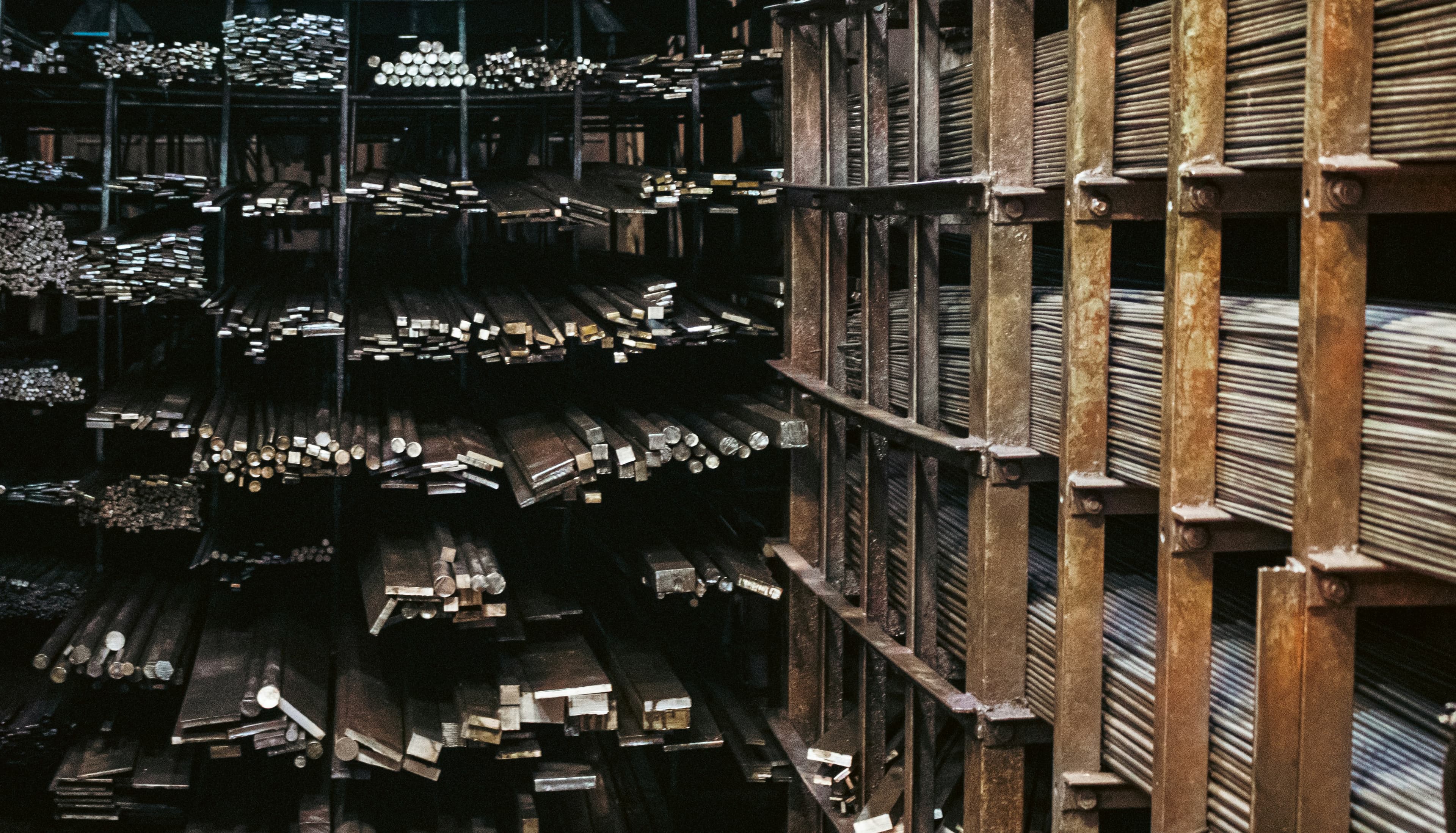 High-bay warehouse with palletized metal inventory
